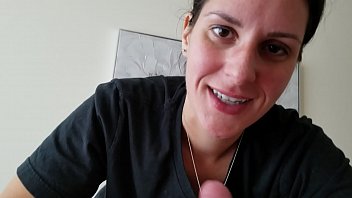 a girl sucking on a dick